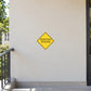 Road Sign Sticker applied in A school campus facilities entrance, uninterrupted pale cream plaster wall, railing only extreme left and lower edge