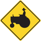 Yellow warning road sign sticker with black excavator silhouette, diamond shape.