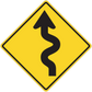 Yellow road sign sticker: black-bordered diamond with upward and curved arrow