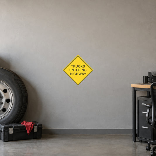 Yellow road sign sticker: trucks entering highway, diamond warning shape