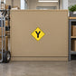 Road Sign Sticker applied in A delivery center routing office, smooth muted ochre cabinet front, hand truck extreme left