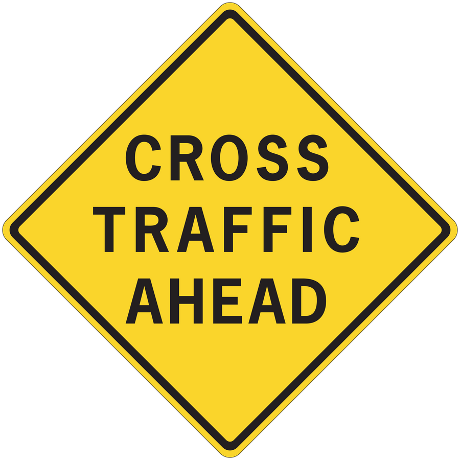 Yellow road sign sticker with black border text "CROSS TRAFFIC AHEAD"