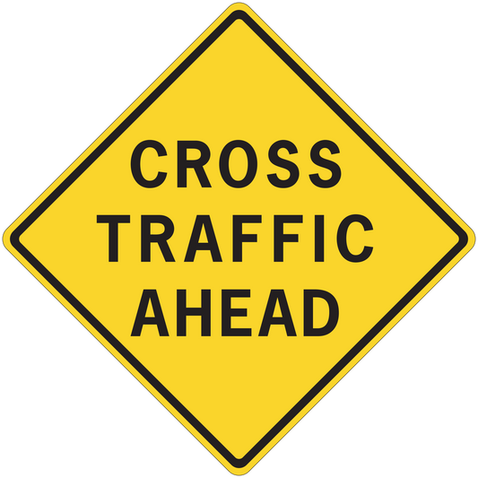 Yellow road sign sticker with black border text "CROSS TRAFFIC AHEAD"