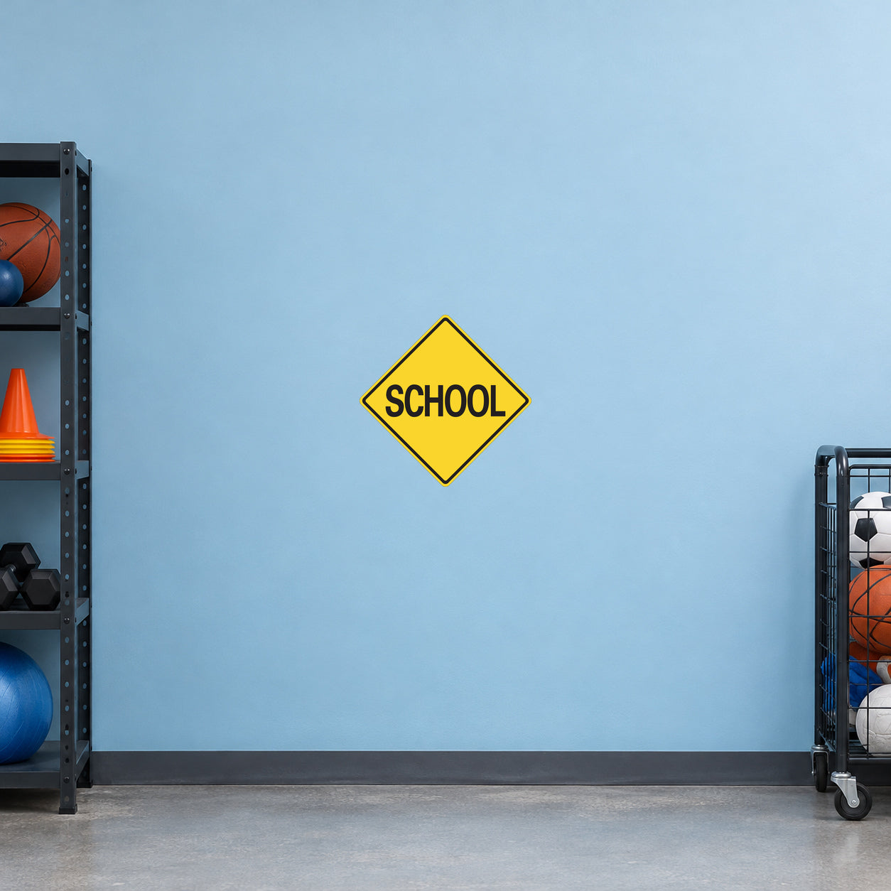 Road Sign Sticker applied in A school facilities storage area, uninterrupted light blue painted wall, sports equipment cart extreme right