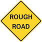 Yellow diamond road sign sticker with black border reading “ROUGH ROAD”