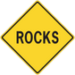 Yellow road sign sticker, diamond shape with black border and ROCKS text