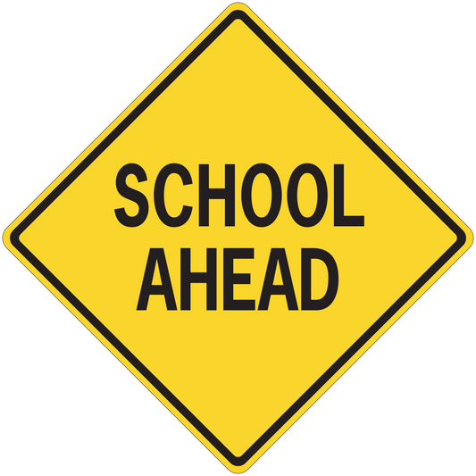 Yellow road sign sticker, black-bordered diamond reading SCHOOL AHEAD