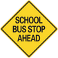 Yellow road sign sticker with black border and 'SCHOOL BUS STOP AHEAD' text