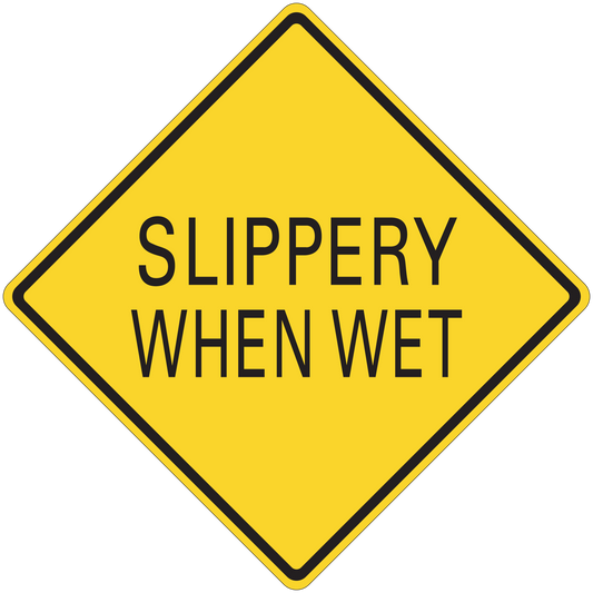 Road sign sticker with yellow diamond and black border, text “SLIPPERY WHEN WET”