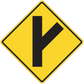 Yellow road sign sticker with black diamond and arrow pointing down