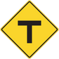 Road sign sticker: yellow diamond with black border and T symbol