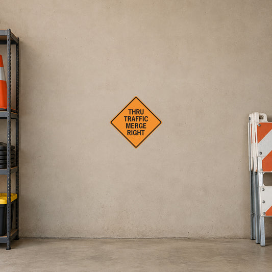Orange diamond road sign sticker with text "THRU TRAFFIC MERGE RIGHT"