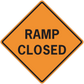 Road sign sticker: orange diamond with black border and 'RAMP CLOSED' text