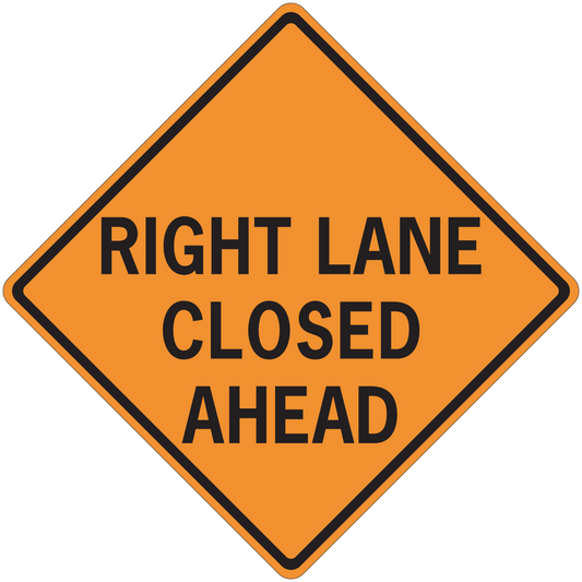 Orange road sign sticker: black text 'RIGHT LANE CLOSED AHEAD'.