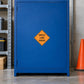 Road Sign Sticker applied in A logistics traffic storage room, smooth deep blue single cabinet panel, orange cone far right