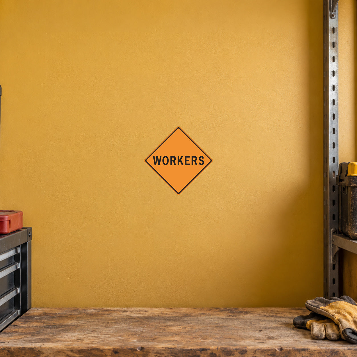 Road sign sticker with orange diamond and 'WORKERS' text