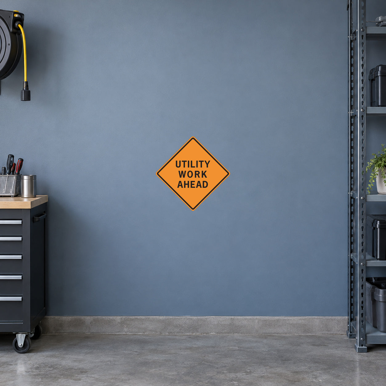 Orange diamond road sign sticker reading "UTILITY WORK AHEAD"