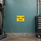Road sign sticker: yellow rectangle with black text 'USE LOW GEAR'.