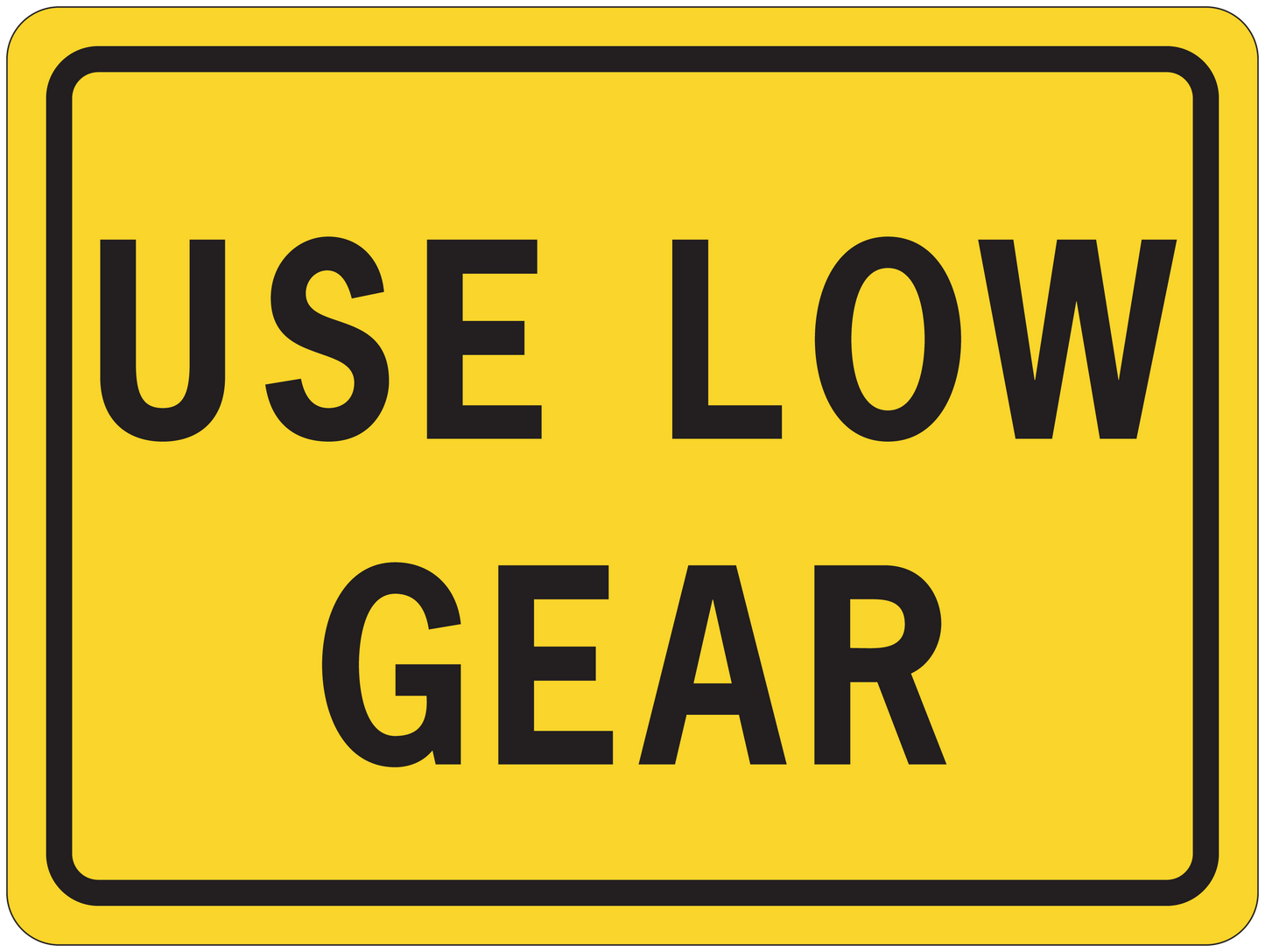 Road sign sticker, yellow with black border and text “USE LOW GEAR”