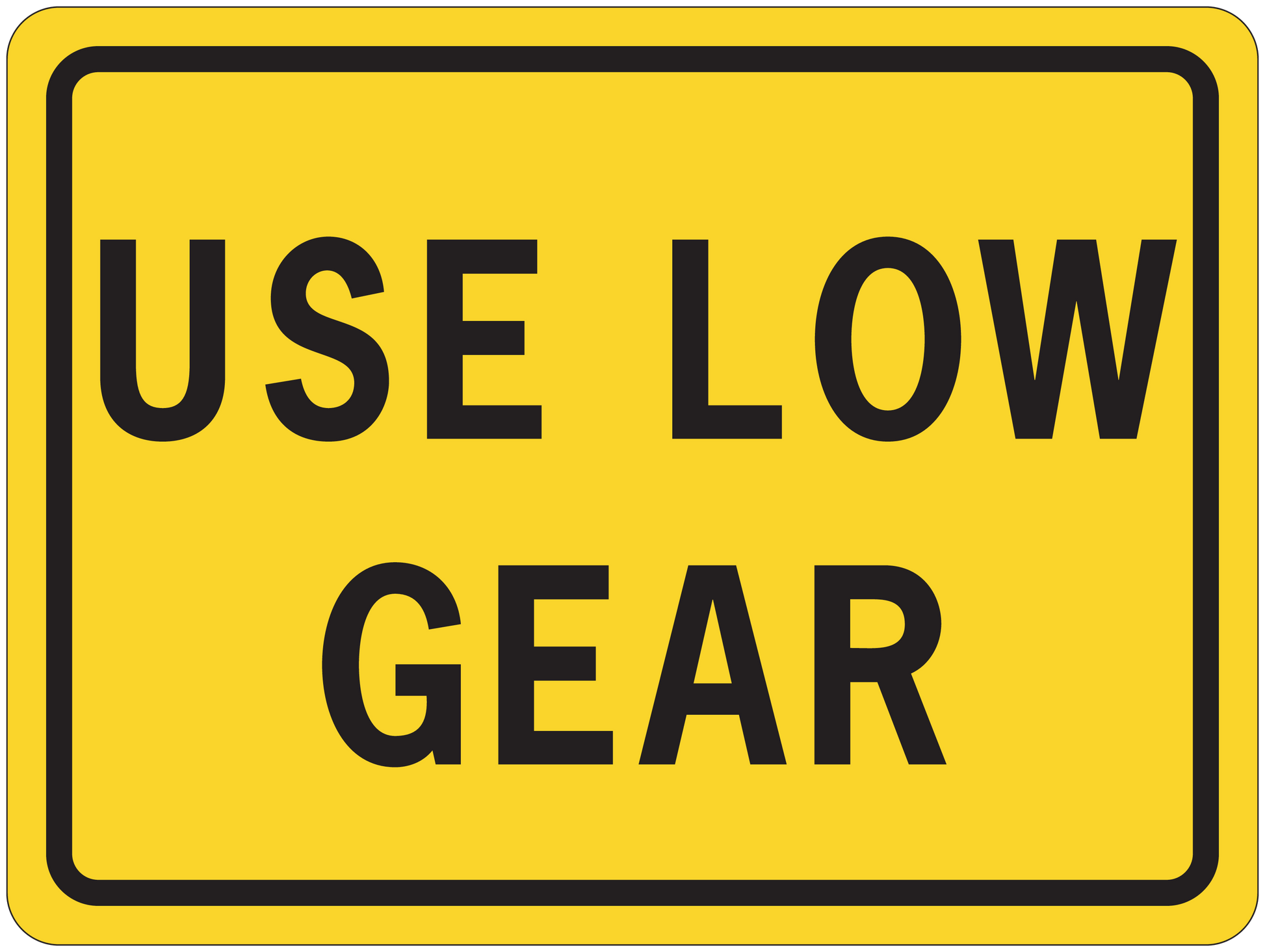 Road sign sticker, yellow with black border and text “USE LOW GEAR”
