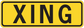 Yellow road sign sticker with black 'XING' lettering