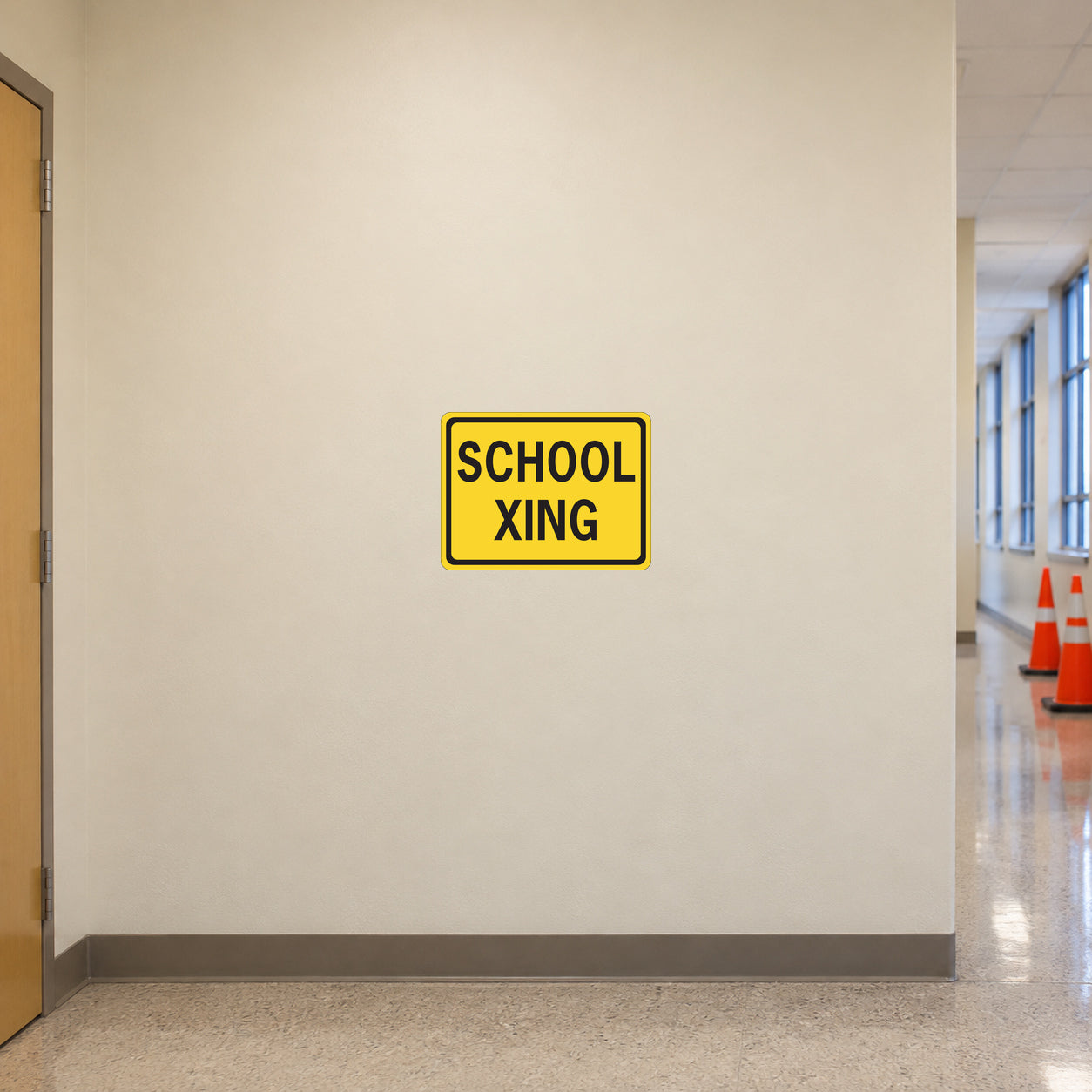 Road Sign Sticker applied in a continuous warm cream school service corridor wall with safety cones at far right