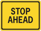 Road sign sticker with yellow STOP AHEAD message in black lettering