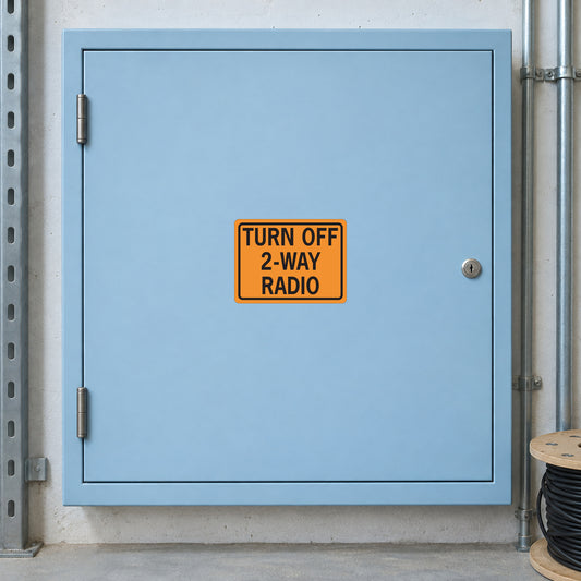 Orange road sign sticker with text: “TURN OFF 2-WAY RADIO”
