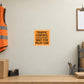 Road Sign Sticker applied in a continuous light cream dispatch office service wall, orange vest and clipboard at extreme edges