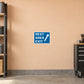 Road sign sticker with blue REST AREA EXIT text and white arrow