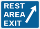 Blue road sign sticker with white border text “REST AREA EXIT” and upward arrow