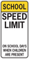 Road sign sticker with 'SCHOOL' and 'SPEED LIMIT' and 'ON SCHOOL DAYS' message