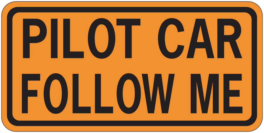 Road sign sticker with orange border and black text: 'PILOT CAR FOLLOW ME'