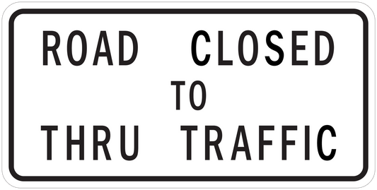 Road sign sticker reading 'ROAD CLOSED TO THRU TRAFFIC'