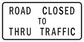 Road sign sticker reading 'ROAD CLOSED TO THRU TRAFFIC'