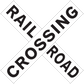 Crossed road sign stickers reading 'RAIL CROSSING'