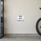 Road Sign Sticker applied in a continuous creamy bicycle garage wall with rear bicycle tire at extreme right
