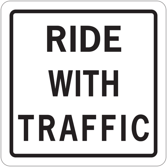 Road sign sticker: 'RIDE WITH TRAFFIC' black text on white background