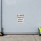 Square road sign sticker, white with black text: SLOWER TRAFFIC KEEP RIGHT