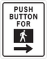 Road sign sticker with "PUSH BUTTON FOR" text, person icon and right arrow
