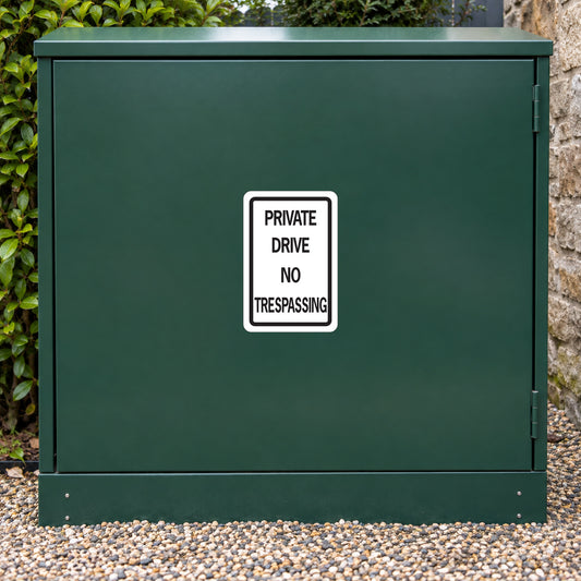Road sign sticker with PRIVATE DRIVE NO TRESPASSING text