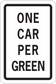 Road sign sticker with 'ONE CAR PER GREEN' text