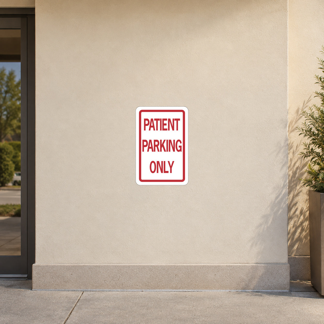 Square road sign sticker with red border reading "PATIENT PARKING ONLY"