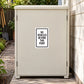 Road Sign Sticker applied in a smooth light cream single grounds maintenance cabinet beside a narrow service path, garden tools at far edge