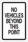 Road sign sticker with black border and text: “NO VEHICLES BEYOND THIS POINT”