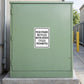 Road Sign Sticker applied in a smooth pale green single industrial service cupboard beside a restricted maintenance path