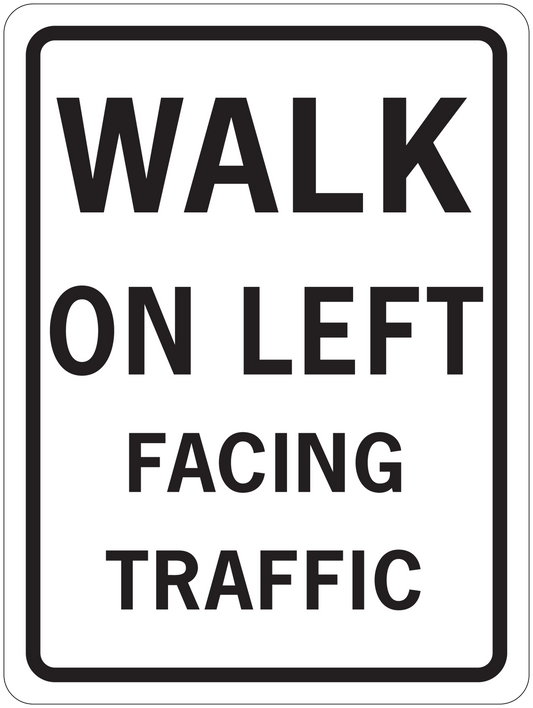 Road sign sticker with black border reading “WALK ON LEFT FACING TRAFFIC” on white background