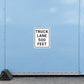 Road Sign Sticker applied in a continuous pale blue freight dispatch wall with wheel chock at bottom left edge