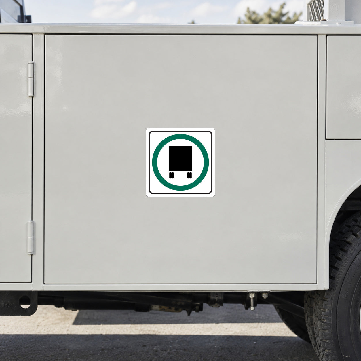 Road sign sticker with green circular road sign icon and black square inside.