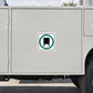Road sign sticker with green circular road sign icon and black square inside.